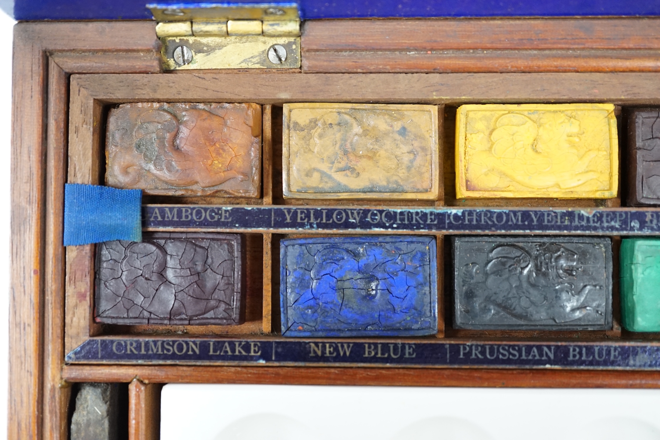 A Victorian Winsor and Newton artist's box with watercolour blocks, palettes etc. with key. Condition - fair